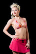 blond caucasian woman in bikini top and pink skirt look one side blond caucasian woman in bikini top and pink skirt look one side