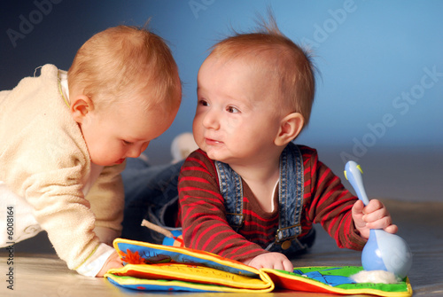 Photo: Babies playing with toys Babies playing with toys