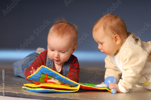 Photo: Babies playing with toys Babies playing with toys