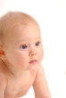 A naked baby looking around