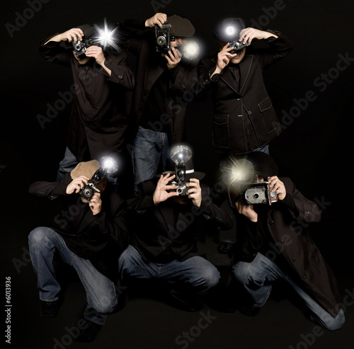 Photo: Retro style paparazzi press photographers with vintage cameras Retro style paparazzi press photographers with vintage cameras