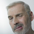 Grimacing man