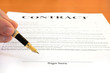 Photo: Hand pointing at signature place on a contract document Hand pointing at signature place on a contract document