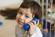 Child using toy phone Child using toy phone