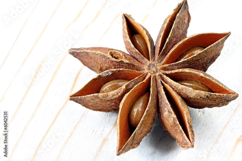 A single star anise, on weathered timber A single star anise, on weathered timber