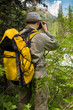 traveller with camera in mountains