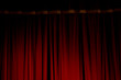 Red velvet curtains of the theater stage