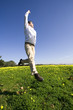 a young man jumping high to sucess