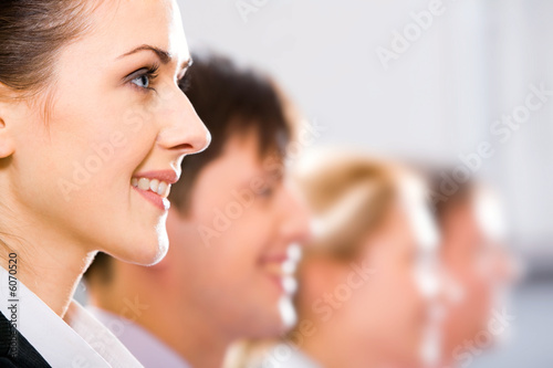 Photo: Row of half faces of young successful professionals Row of half faces of young successful professionals