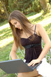 Beautiful young girl working on laptop