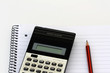 Scientific calculator and pencil on a notebook Scientific calculator and pencil on a notebook