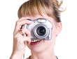 Young woman with digital camera. Isolated on white.