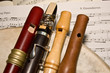 Wooden whistles, recorder and chalumeau  on sheet music