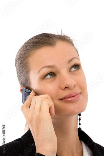 Photo: young and beautiful businesswoman talking on the cell phone young and beautiful businesswoman talking on the cell phone
