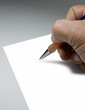 Hand with pen about to write on paper
