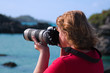 Photographer, Female, with Large White Lens