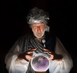 Photo: Swami gazing into a crystal ball Swami gazing into a crystal ball