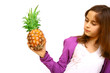 .Teen holding large pineapple