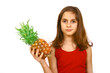 Teen holding large pineapple
