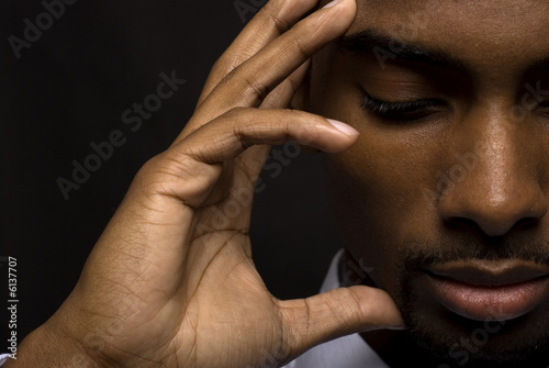 Foto: African American businessman is thinking intensely African American businessman is thinking intensely