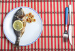 grilled fish served with vegetables