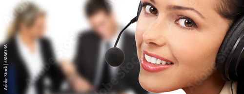 Smiling pretty business woman with headset. .