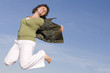 woman jumping in the sky, happy because spring is coming woman jumping in the sky, happy because spring is coming