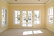 bedroom with windows and doors looking onto porch with view