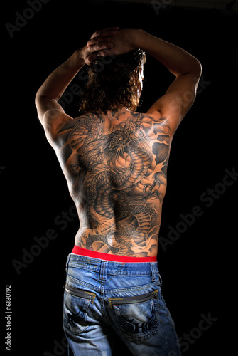 Male back with tattoo.
