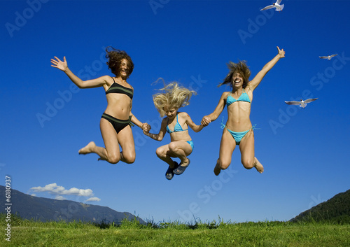 two girls having fun with a child.