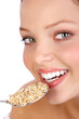 Pretty  woman eating the healthy food. Isolated over white.