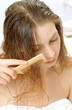 Girl combing hair Girl combing hair