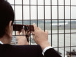 Businessman photographing an airport Businessman photographing an airport