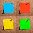 Foto: Different colors note papers and red pins. Different colors note papers and red pins.