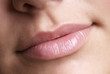 detail of a pink made up lip and nose