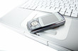 Cellphone over a laptop computer kayboard