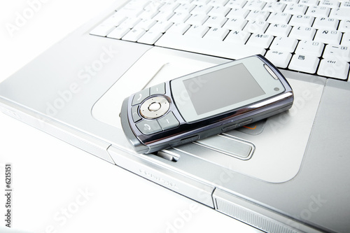 Cellphone over a laptop computer kayboard