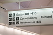Direction signs in an airport terminal for travelers Direction signs in an airport terminal for travelers