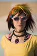 Photo : Portrait of a Punk Girl with Bright Colorful and Sunglasses Portrait of a Punk Girl with Bright Colorful and Sunglasses