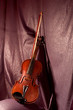 Old violin with string on textile backgrounds