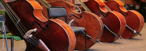 Photo: Vintage, music instruments, four old bass viols Vintage, music instruments, four old bass viols