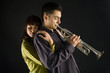 The woman huging the trumpet man. 