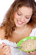Pretty  woman eating the healthy food. Isolated over white.