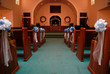 church aisle with blue ribbons