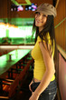 Portrait of a hip beautiful young woman in cap hat. Shallow DOF.