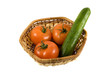 An isolated crib (basket) with tomatoes and cucumber An isolated crib (basket) with tomatoes and cucumber