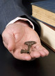 A businessman hand off the key to success. Education.