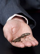 A businessman hands off the key to success.