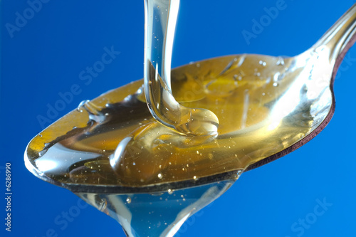 Photo: honey in spoon honey in spoon