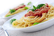 Pasta with tomato sauce basil and grated parmesan